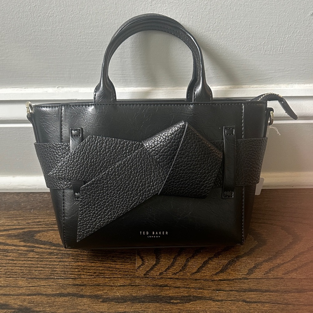 New! Ted Baker Bag in perfect condition. Comes with crossbody strap.